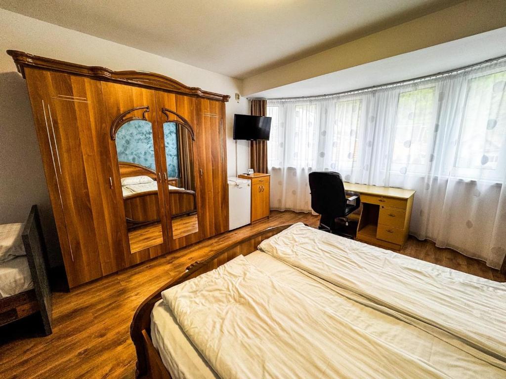 Postel nebo postele na pokoji v ubytování Hotel Dalia