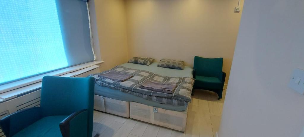 Ένα ή περισσότερα κρεβάτια σε δωμάτιο στο Romford Lodge