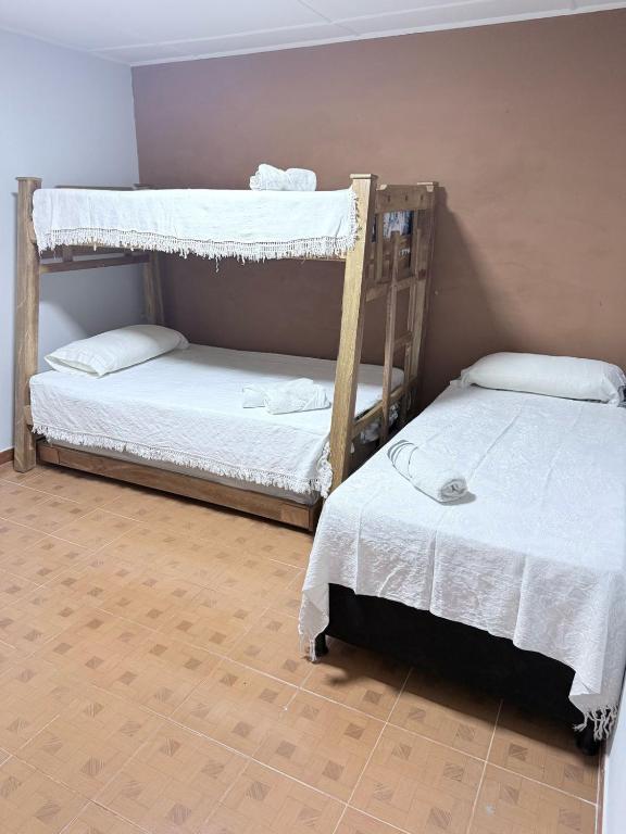 Postel nebo postele na pokoji v ubytování Casa hotel la 33