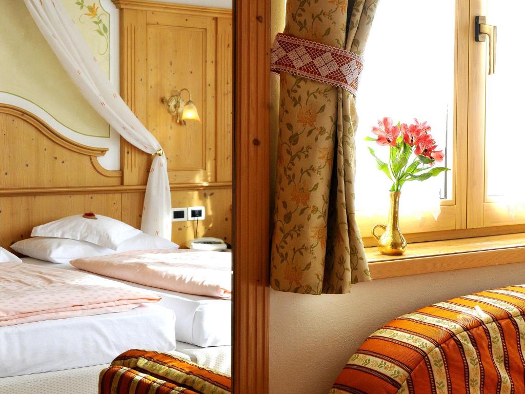 Postel nebo postele na pokoji v ubytování Hotel Cesa Padon