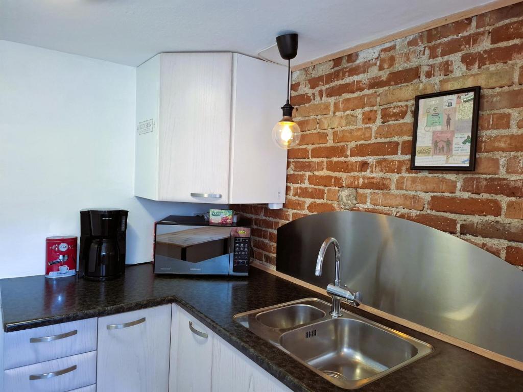 Kuchyň nebo kuchyňský kout v ubytování COZY VOGI Flat