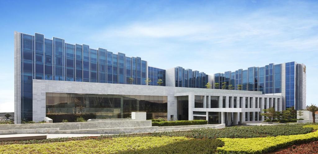 a large office building with a lot of windows at Taj Bangalore in Devanahalli-Bangalore