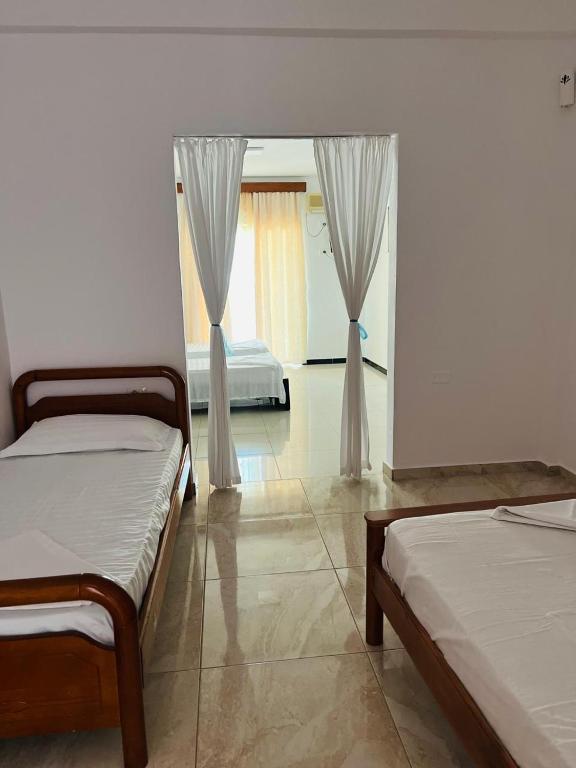 Postel nebo postele na pokoji v ubytování Hotel Jonufra
