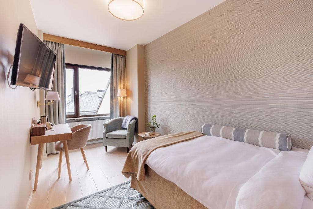 TV a/nebo společenská místnost v ubytování Home Hotel Wellington