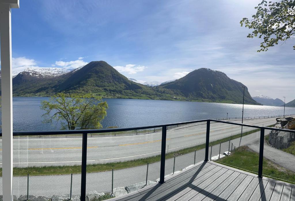 a view of a body of water with mountains at Husslåttene apartments 2 in Skei