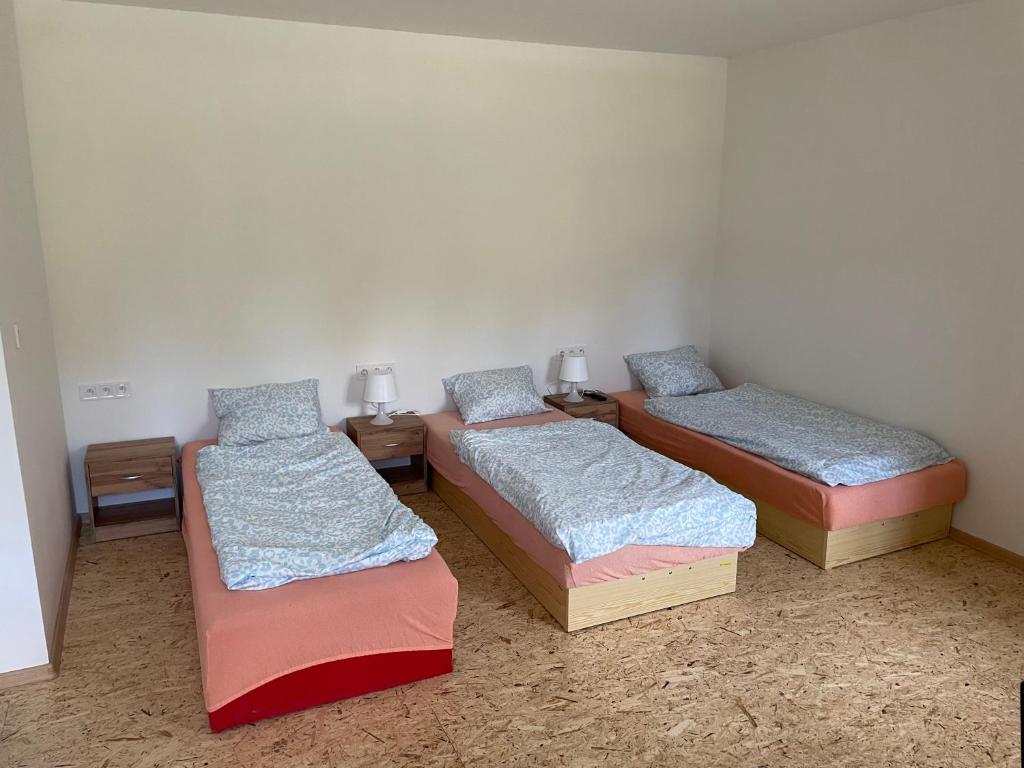 Postel nebo postele na pokoji v ubytování Apartmány J L A