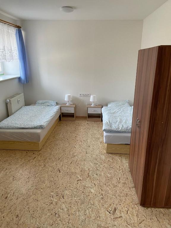 Postel nebo postele na pokoji v ubytování Apartmány J L A