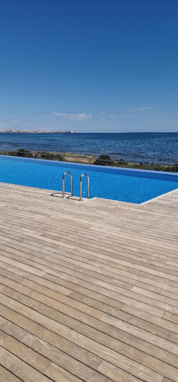 Posidonia Apartment, ground floor with garden,3 swimming pools, jacuzzi,parking space