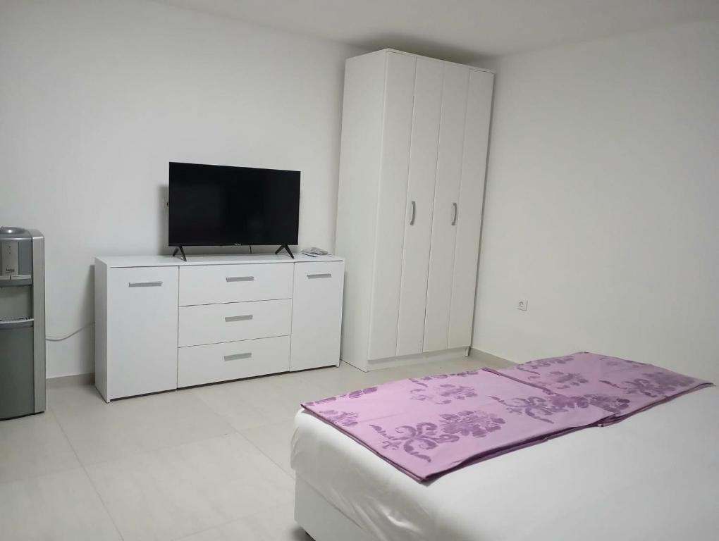 Postel nebo postele na pokoji v ubytování Apartments Merin