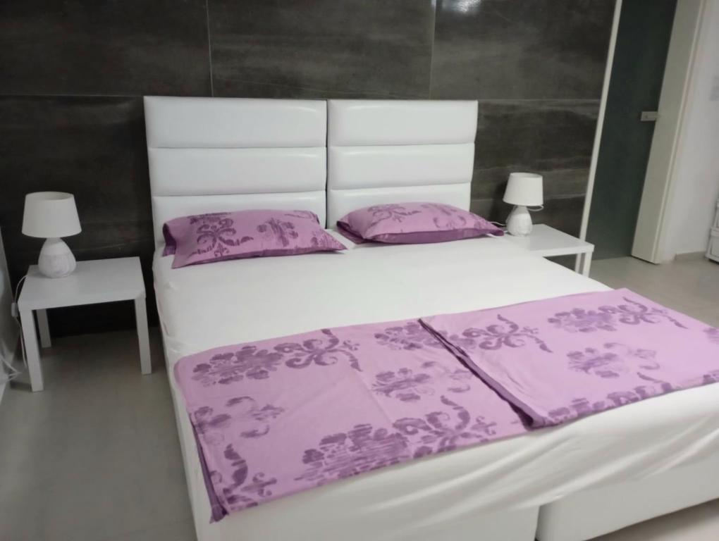 Postel nebo postele na pokoji v ubytování Apartments Merin