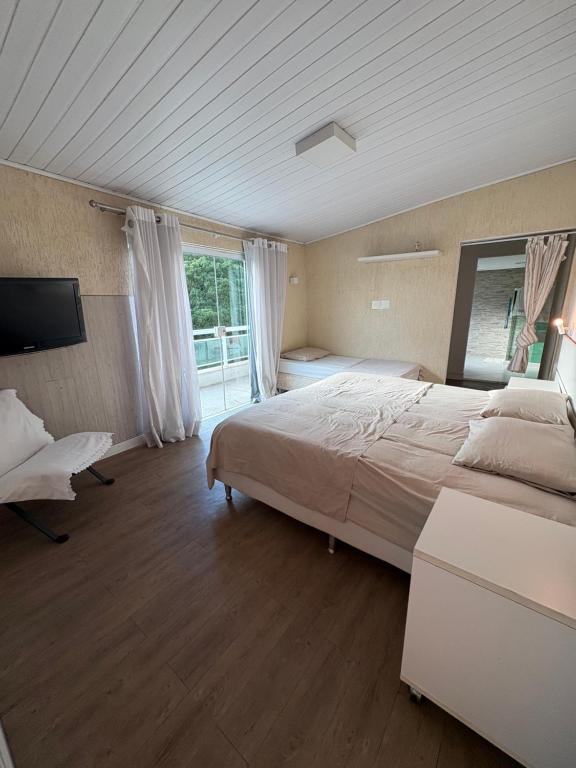 Postel nebo postele na pokoji v ubytování Casa da Lagoa
