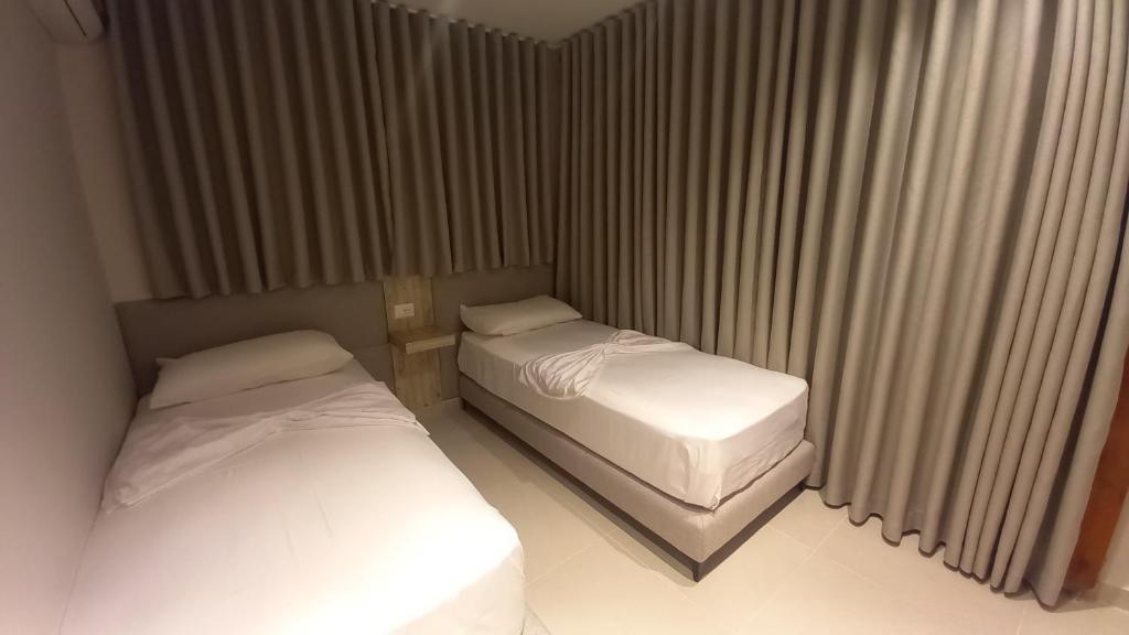 Postel nebo postele na pokoji v ubytování Hotel Aglon