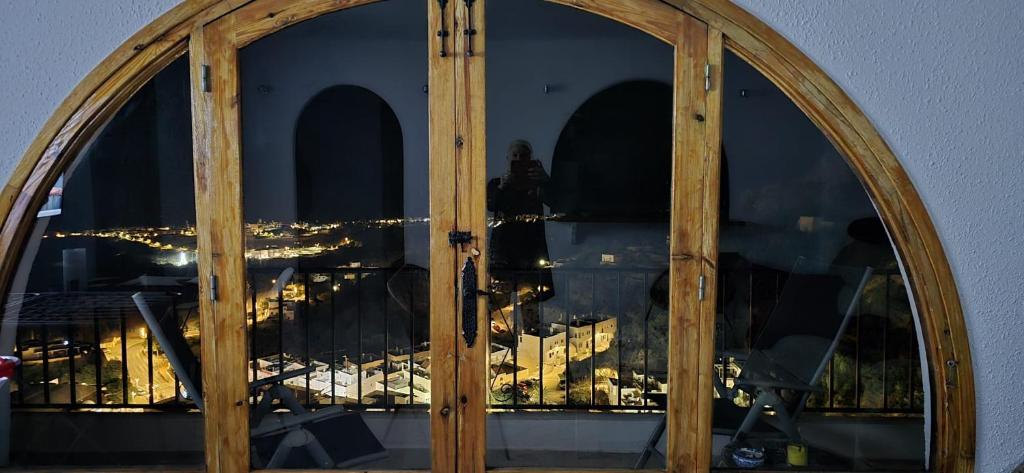 a glass door with a view of a city at Apartamento Buena Vista in Mojácar