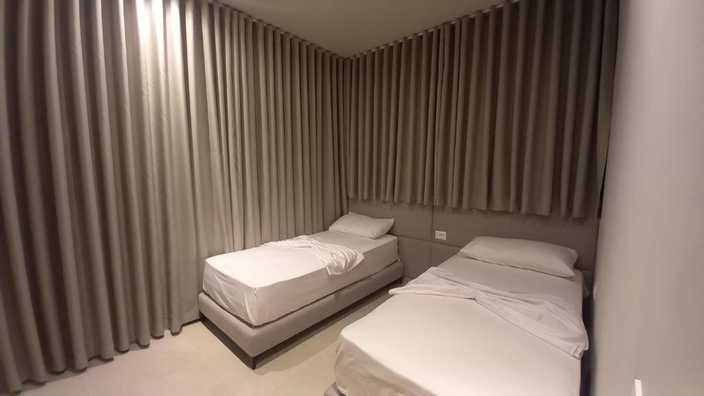Postel nebo postele na pokoji v ubytování Hotel Aglon