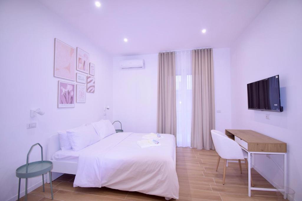 Ένα ή περισσότερα κρεβάτια σε δωμάτιο στο La Vela Guest House