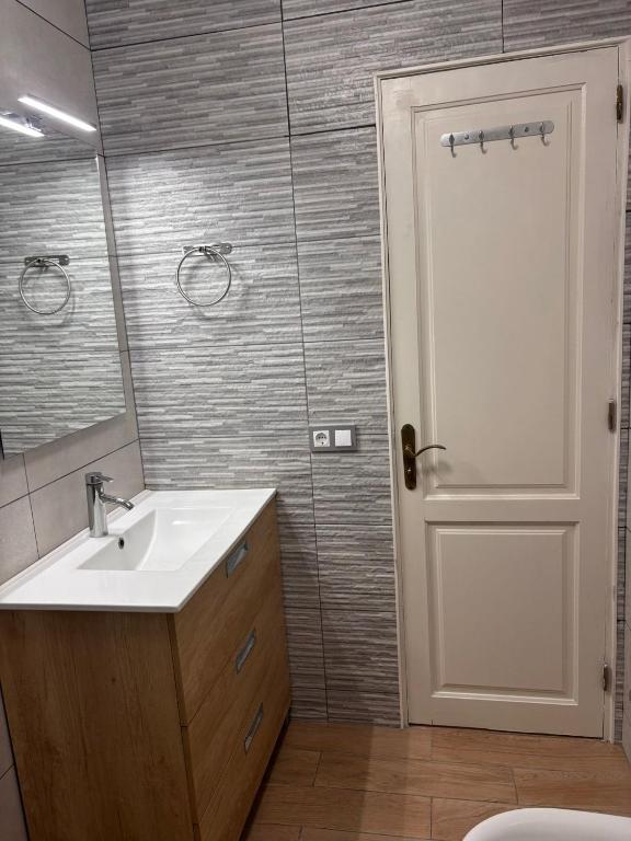 A bathroom at First Line Beach Apartment with Ocean View La Arena