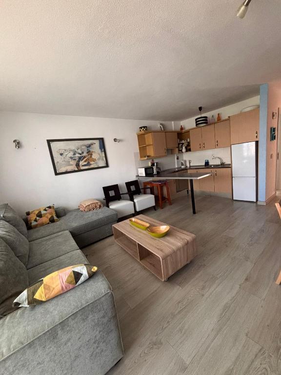 A kitchen or kitchenette at First Line Beach Apartment with Ocean View La Arena