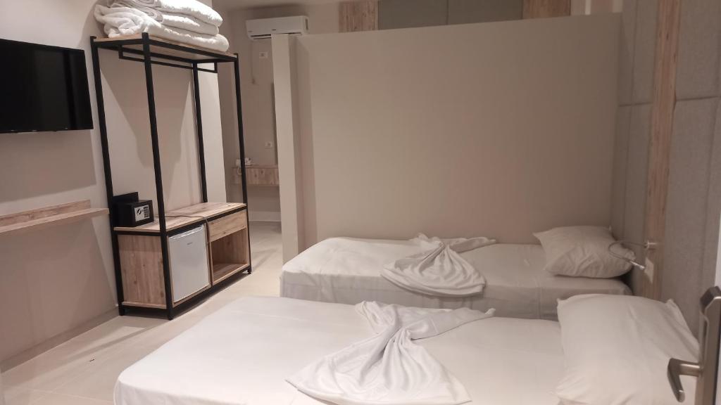 Postel nebo postele na pokoji v ubytování Hotel Aglon