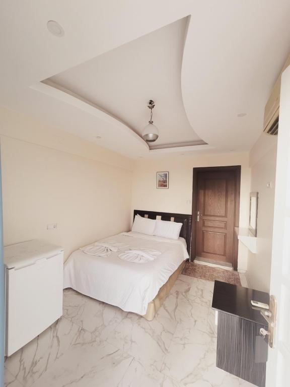 Postel nebo postele na pokoji v ubytování shah sultan Ozturk Hotel
