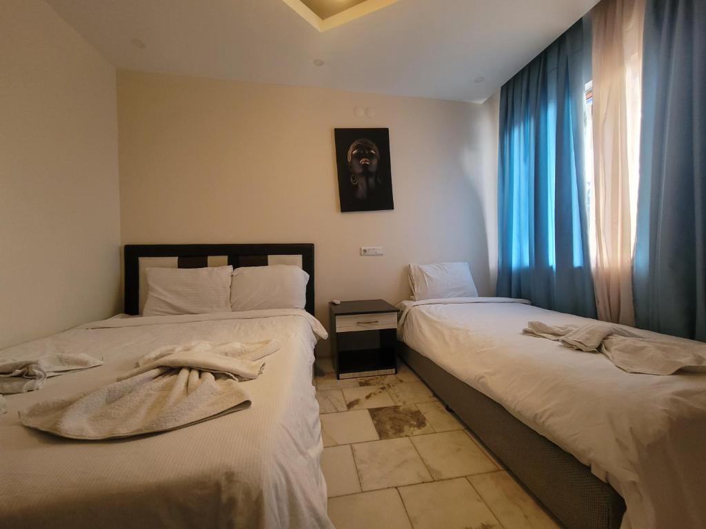 Postel nebo postele na pokoji v ubytování shah sultan Ozturk Hotel