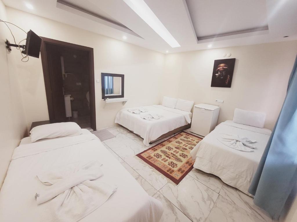 Postel nebo postele na pokoji v ubytování shah sultan Ozturk Hotel
