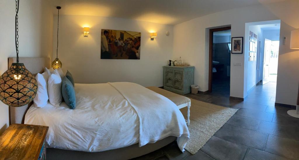 Łóżko lub łóżka w pokoju w obiekcie B&B Casa Luz del Sur, adults only