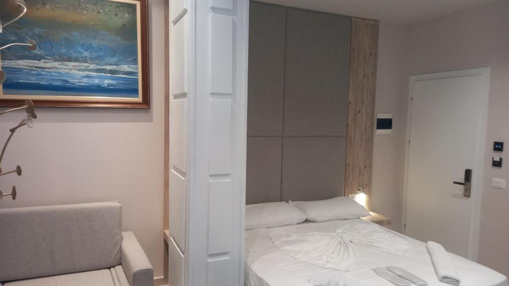 Postel nebo postele na pokoji v ubytování Hotel Aglon