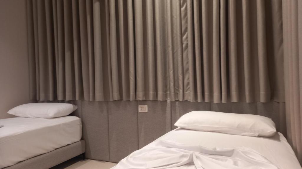 Postel nebo postele na pokoji v ubytování Hotel Aglon