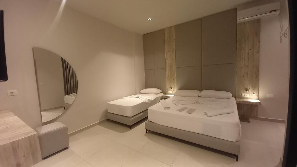 Postel nebo postele na pokoji v ubytování Hotel Aglon