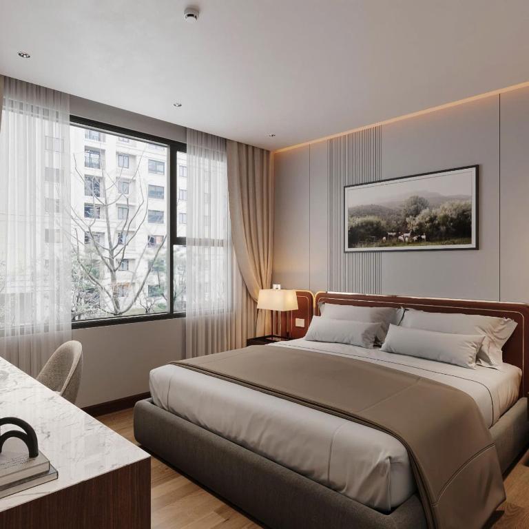 Postel nebo postele na pokoji v ubytování San Hanoi Hotel & Spa