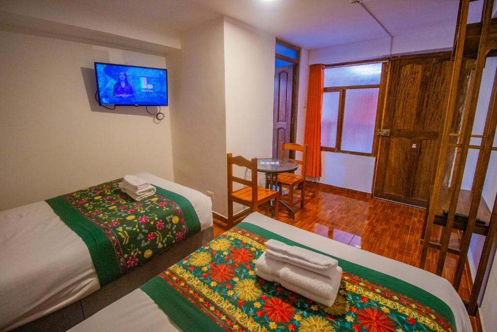 Postel nebo postele na pokoji v ubytování Munay Ñusta Cusco