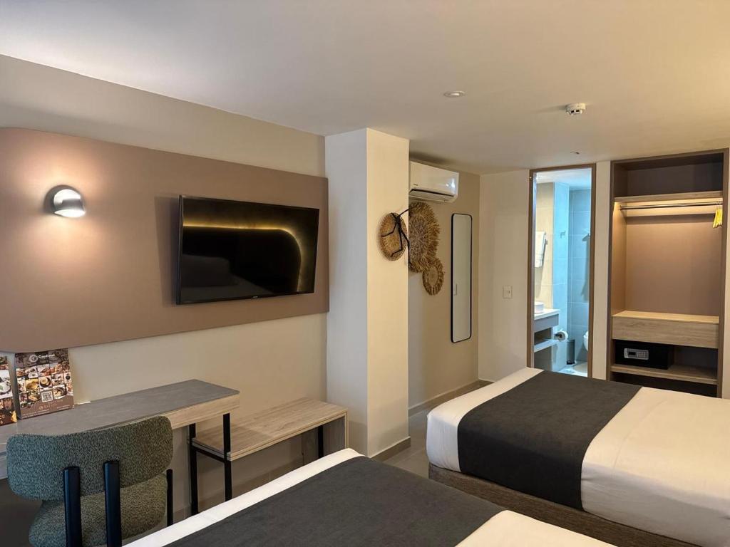 Postel nebo postele na pokoji v ubytování Zi One Luxury Hotel