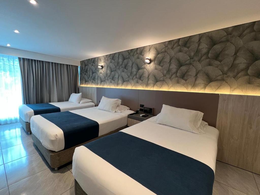 Postel nebo postele na pokoji v ubytování Zi One Luxury Hotel