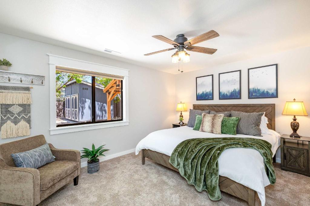 a bedroom with a bed and a ceiling fan at Happy Trails Flagstaff in Flagstaff