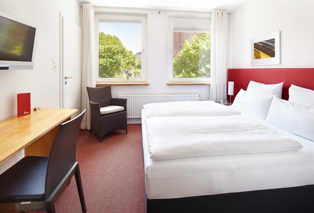 Postel nebo postele na pokoji v ubytování Hotel an der Marienkirche