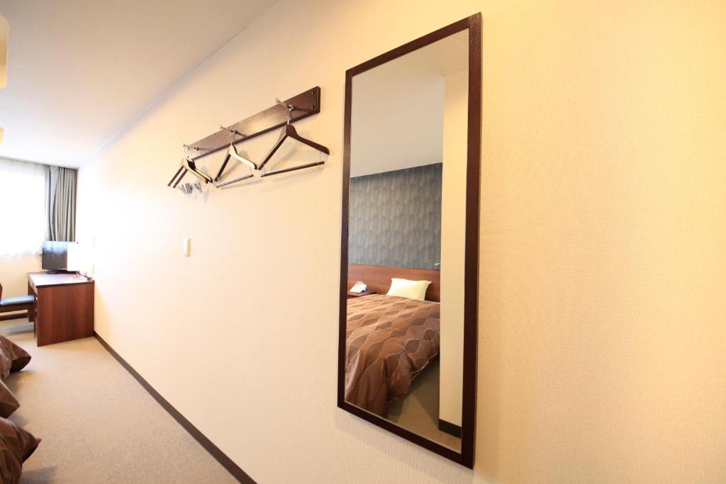 Postel nebo postele na pokoji v ubytování Hotel Togariishi