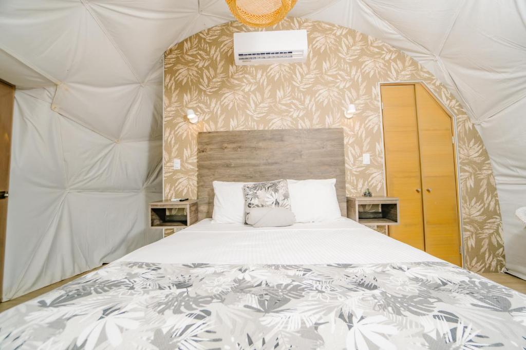 Postel nebo postele na pokoji v ubytování Glamping Tortuga Verde