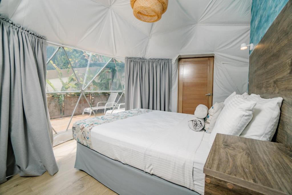 Postel nebo postele na pokoji v ubytování Glamping Tortuga Verde