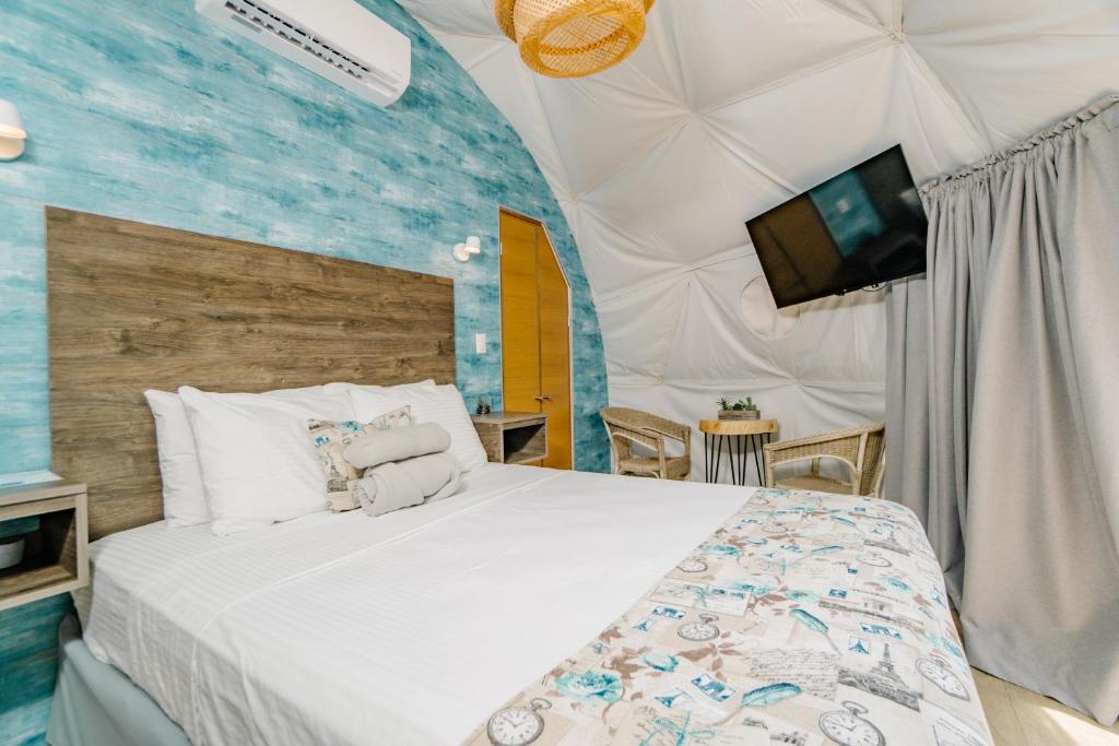 Postel nebo postele na pokoji v ubytování Glamping Tortuga Verde