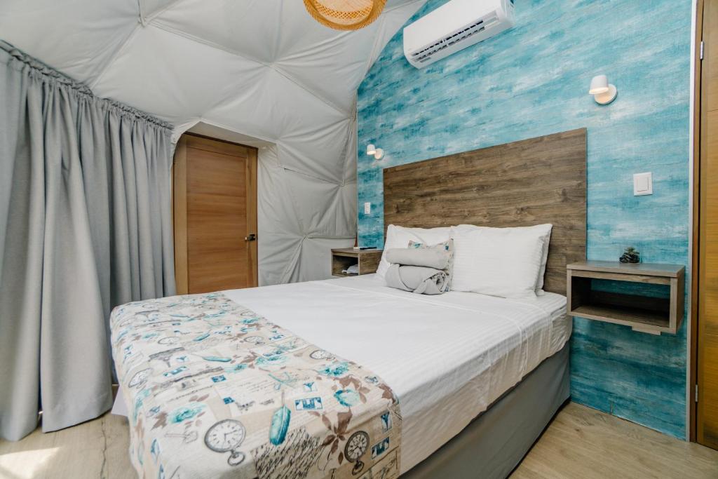 Postel nebo postele na pokoji v ubytování Glamping Tortuga Verde
