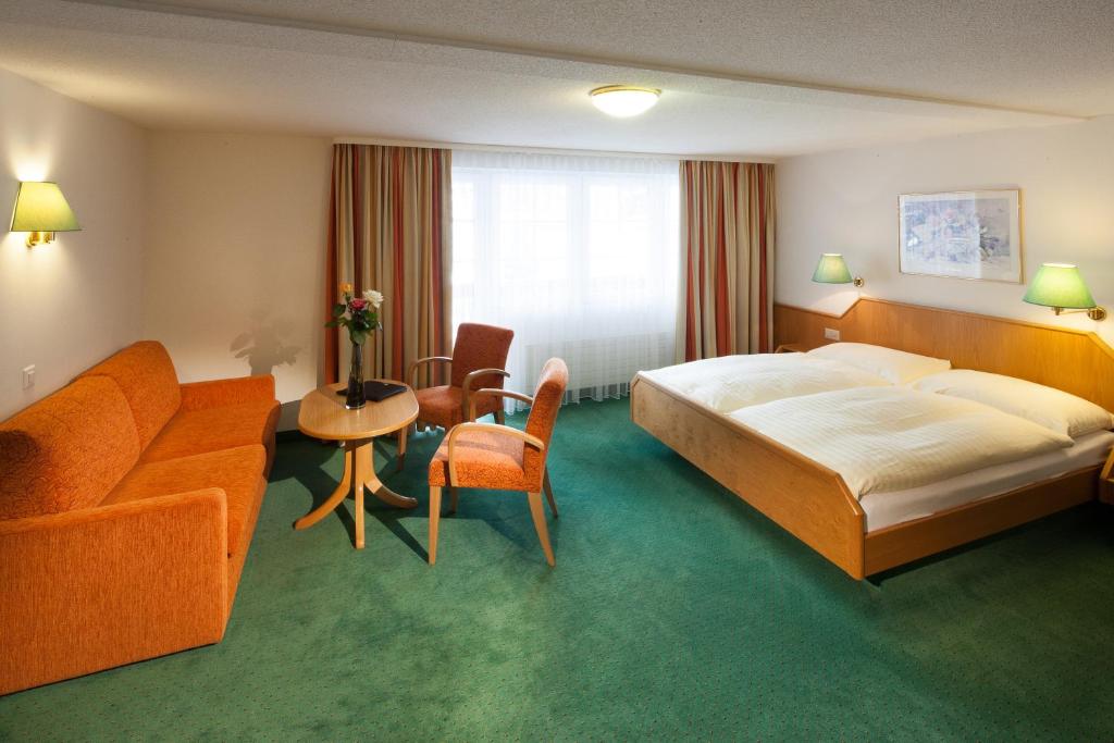 Postel nebo postele na pokoji v ubytování Hotel Cheminee