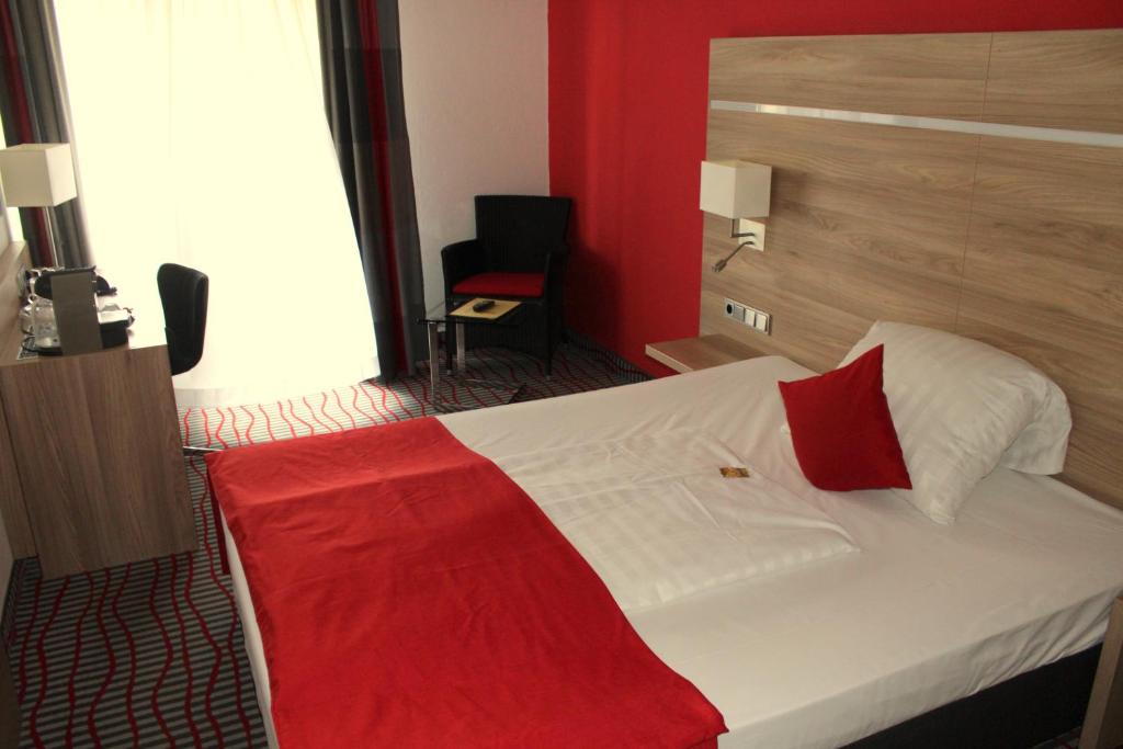 Postel nebo postele na pokoji v ubytování NP Hotel Wallis