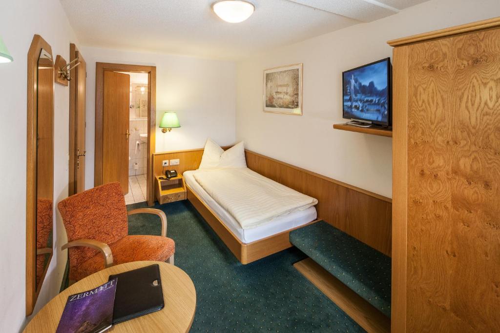 Postel nebo postele na pokoji v ubytování Hotel Cheminee