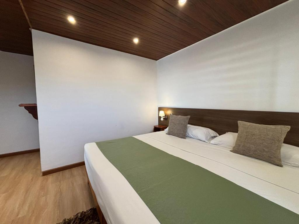 Postel nebo postele na pokoji v ubytování Casa D´Cristhi
