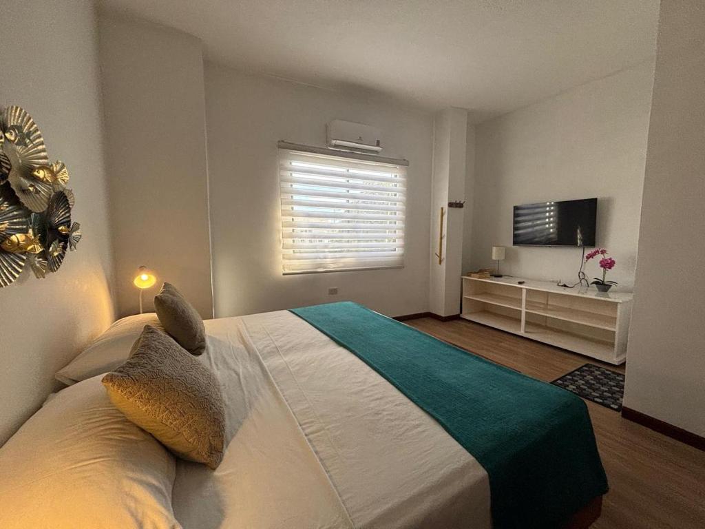 Postel nebo postele na pokoji v ubytování Casa D´Cristhi