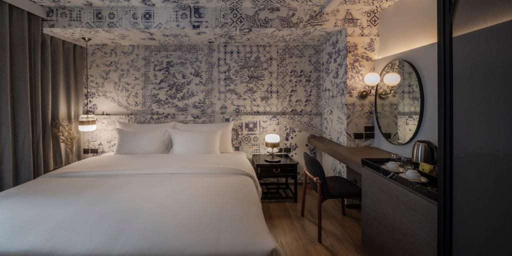 Postel nebo postele na pokoji v ubytování PASSA Hotel Bangkok