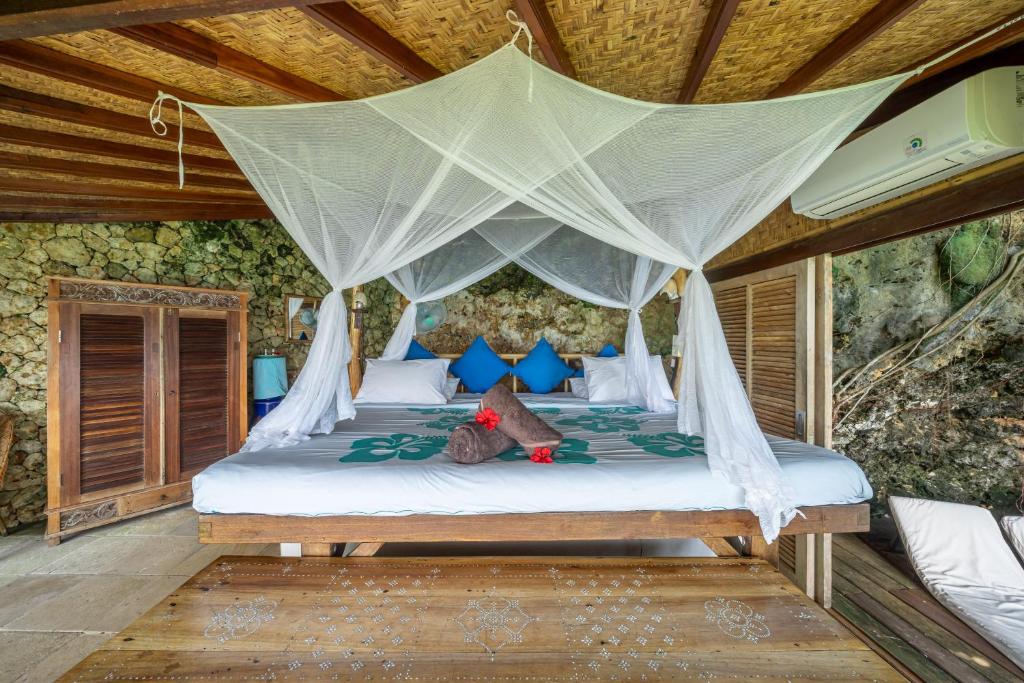 Postel nebo postele na pokoji v ubytování Mu Bungalows