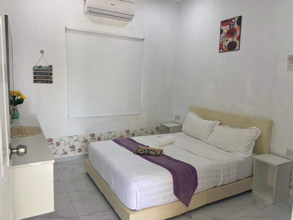 Postel nebo postele na pokoji v ubytování Sammy Hoomestay Ipoh