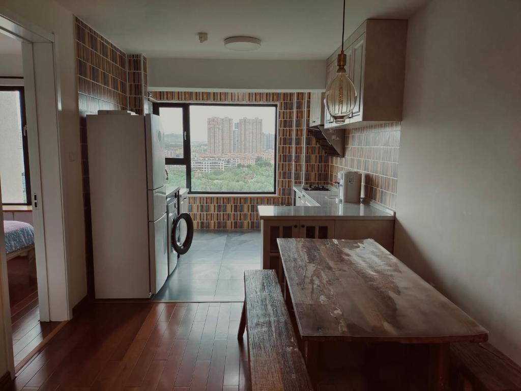 Kuchyň nebo kuchyňský kout v ubytování Yuan Apartment
