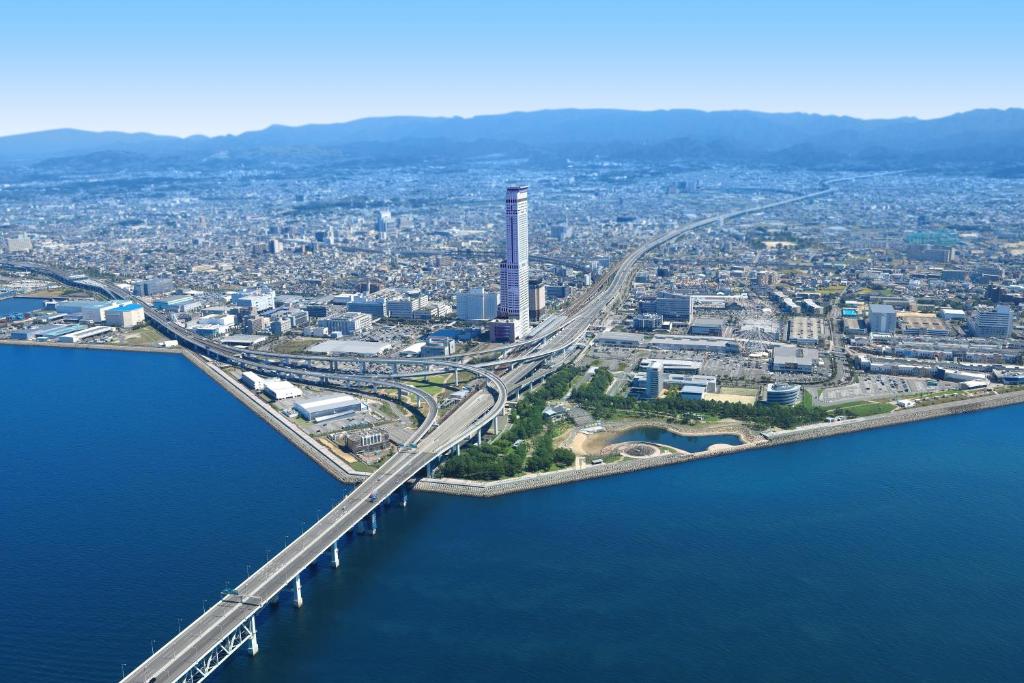 an aerial view of a bridge over a body of water at Odysis Suites Osaka Airport Hotel in Izumi-Sano